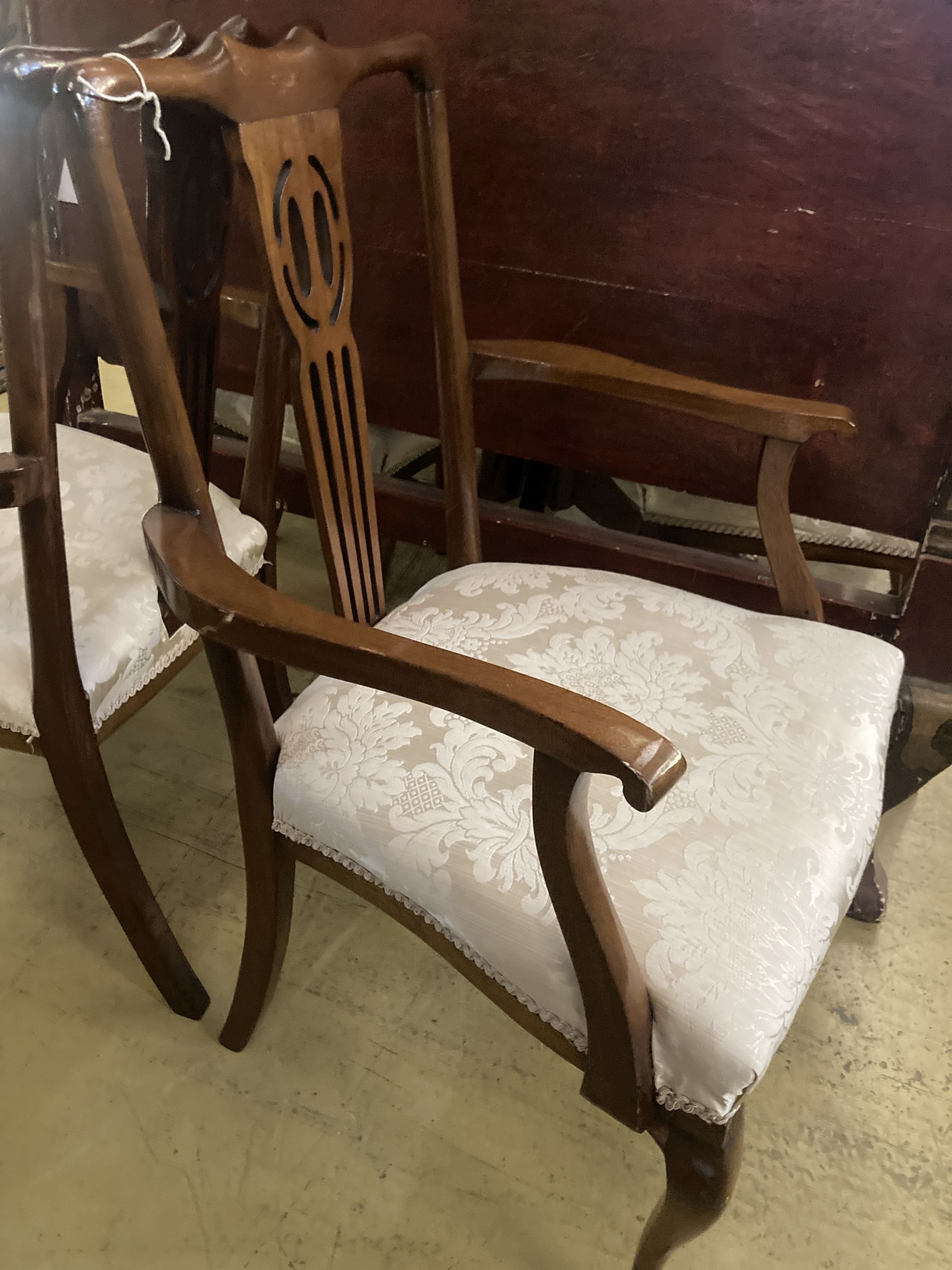 A set of eight Edwardian mahogany dining chairs (two with arms)